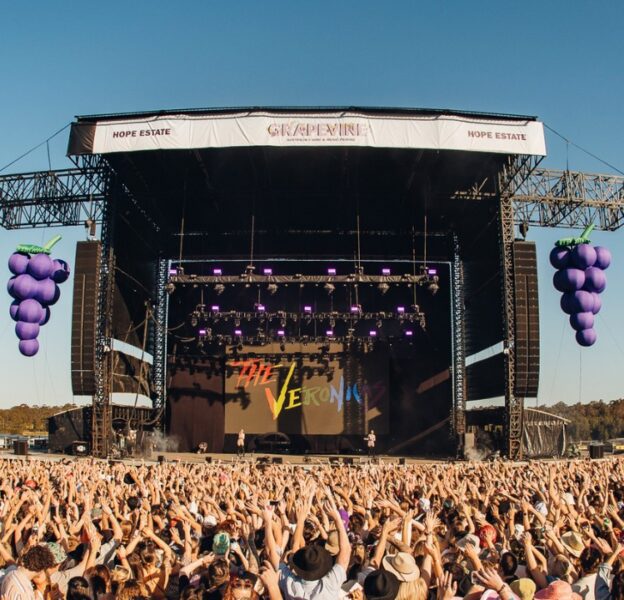 Large crowd of attendees in front of the Grapevine Gathering stage